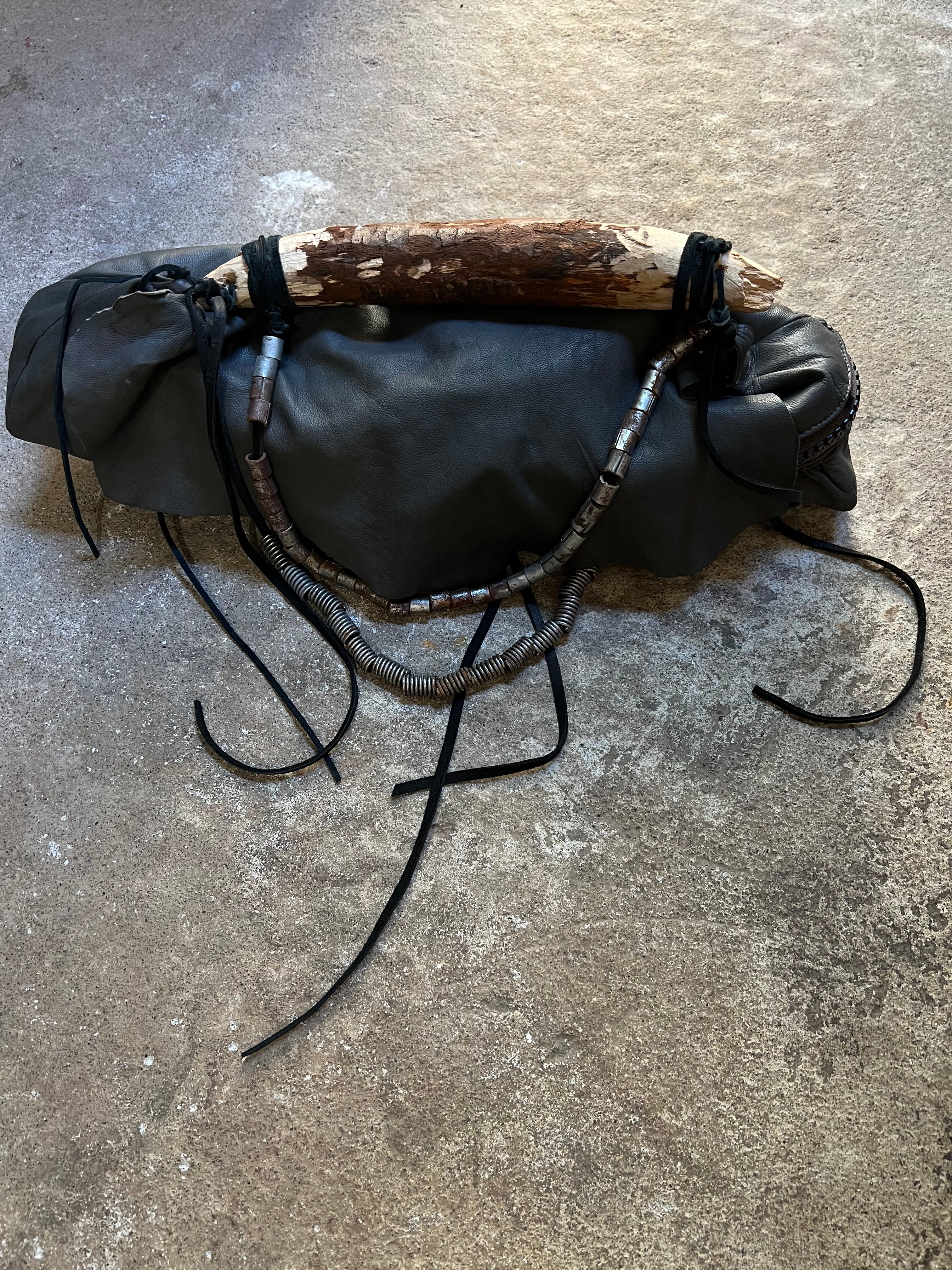 CARVED WOOD HANDLE LEATHER BAG