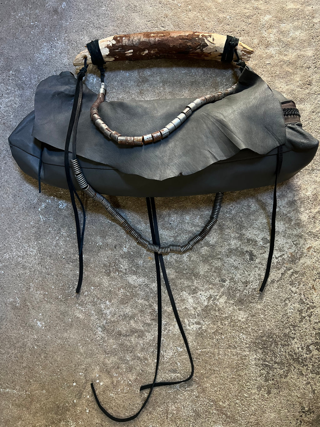 CARVED WOOD HANDLE LEATHER BAG